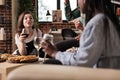 Exalted woman shouting at friends dinner Royalty Free Stock Photo