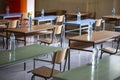 Exam examination room or hall set up ready for students to sit test. multiple desks tables and chairs. Education, school, student Royalty Free Stock Photo