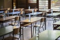 Exam examination room or hall set up ready for students to sit test. multiple desks tables and chairs. Education, school, student Royalty Free Stock Photo