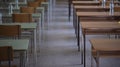 Exam examination room or hall set up ready for students to sit test. multiple desks tables and chairs. Education, school, student Royalty Free Stock Photo