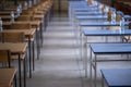 Exam examination room or hall set up ready for students to sit test. multiple desks tables and chairs. Education, school, student Royalty Free Stock Photo