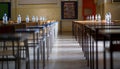 Exam examination room or hall set up ready for students to sit test. multiple desks tables and chairs. Education, school, student Royalty Free Stock Photo