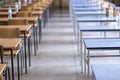 Exam examination room or hall set up ready for students to sit test. multiple desks tables and chairs. Education, school, student Royalty Free Stock Photo