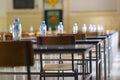 Exam examination room or hall set up ready for students to sit test. multiple desks tables and chairs. Education, school, student Royalty Free Stock Photo