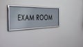 Exam room door desk closeup, student knowledge testing, higher education system