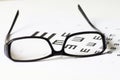 Exam view with Glasses on optometric table Royalty Free Stock Photo