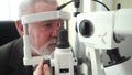 examination of elderly man with slit lamp. equipping ophthalmologist's office.