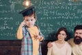 Examination and exam. Little boy think on examination question. Child in graduation cap ready for examination. Focused