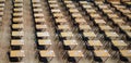 Examination hall set up with chairs and wooden desks. Photographed at Queen Mary, University of London