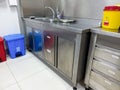 An examination room at a doctor's office. Metal table in hospital for exam patient. hand washing Royalty Free Stock Photo