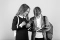 Before examination. Small children prepare for examination. Little girl and boy hold examination paper. Taking writing Royalty Free Stock Photo