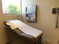 Examination table bed at doctor office Royalty Free Stock Photo