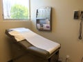 Examination table bed at doctor office Royalty Free Stock Photo