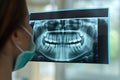 Examined X-ray of patient teeth by an orthodontist stomatologist