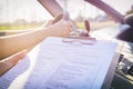 Examiner filling in driver`s license road test form Royalty Free Stock Photo