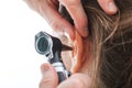 Examining ear with otoscope Royalty Free Stock Photo