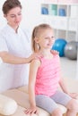 Examining her spine to adjust therapy plan Royalty Free Stock Photo