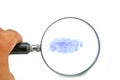 examining thumb impression with hand lens Royalty Free Stock Photo