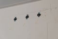 An example of how you can fix the dowels in the wall. Close up. Selective focus
