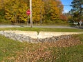 Example photo of a concrete v notch weir, level spreader, located adjacent to a highway swale.