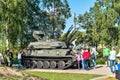 Russia, Priozersk, August 2020. Children and tourists around a modern tank on display in the park.