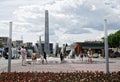 An example of the use of modern LED lights, flower beds, a dry pedestrian fountain and a vertical stele in the design and Royalty Free Stock Photo