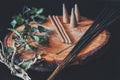 Examples of various types of incense - long black sticks, short hand made sticks and  small triangular cones Royalty Free Stock Photo