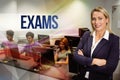 Exams against computer teacher smiling at camera with arms crossed Royalty Free Stock Photo