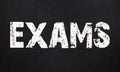 Exams / are written on a chalkboard. Blackboard Royalty Free Stock Photo