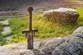 Excalibur, King Arthur's sword in stone. Edged weapons from the legend Pro king Arthur Royalty Free Stock Photo
