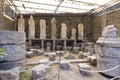 Excavated and preserved statues and columns in Pompeii museum