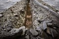 Excavated trench on the road in the city for the reconstruction of the water supply Royalty Free Stock Photo