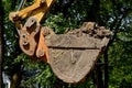 Excavating bucket full of dirt