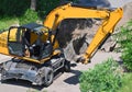 Excavating machine on construction site Royalty Free Stock Photo