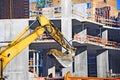 Excavating machine on construction site Royalty Free Stock Photo