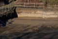 Excavation work in the foundations of the house sunk into the slope. the edges of the pit are fenced with a temporary plank fence. Royalty Free Stock Photo