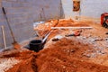 Construction site showing groundwork for plumbing installation in new structure Royalty Free Stock Photo