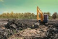Excavation is working on the construction site at the sunset time in the summer Royalty Free Stock Photo
