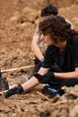 Excavations at the site of a war crime. Site of a mass shooting of people. Human remains bones of skeleton, skulls Royalty Free Stock Photo