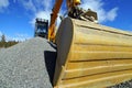 Excavator against blue sky Royalty Free Stock Photo