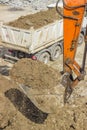 Excavator arm with bucket full of dirt Royalty Free Stock Photo