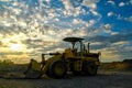 The excavator or backhoe is on a construction site