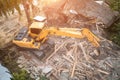 Excavator breaks old house, many dust in air. Building demolition and deconstruction, aerial view