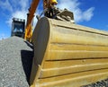 Excavator bucket against blue sky Royalty Free Stock Photo