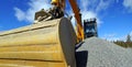 Excavator bucket against blue sky Royalty Free Stock Photo