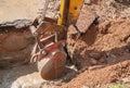 Excavator bucket bulldozer work a hole the repair of pipe Royalty Free Stock Photo