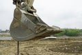 Excavator bucket. Bucket of an excavator on a construction site. detail. Royalty Free Stock Photo