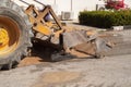 Excavator, bulldozer work a dig hole the repair of pipe Royalty Free Stock Photo