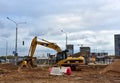 Excavator CATERPILLAR working at construction site. Construction machinery for excavation, loading, lifting and hauling of cargo