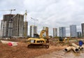 Excavator CATERPILLAR working at construction site. Construction machinery for excavation, loading, lifting and hauling of cargo